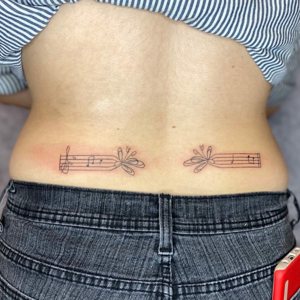Music Note Lower Back Tattoo