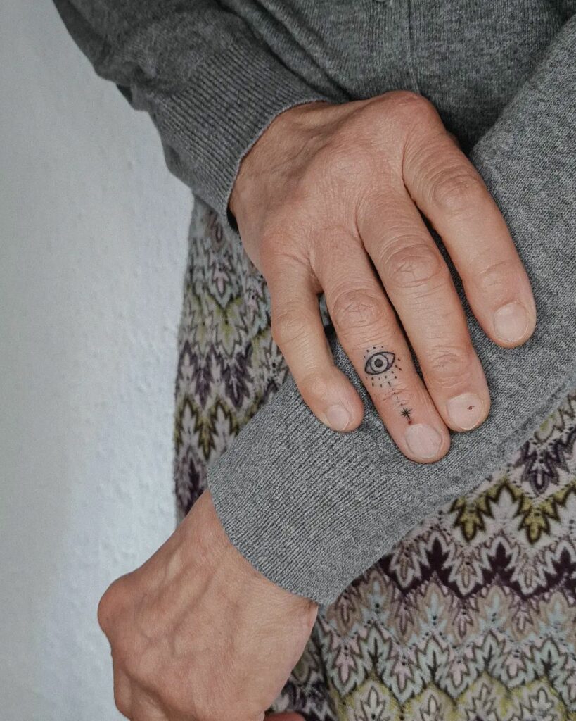The Evil Eye Middle Finger Tattoo