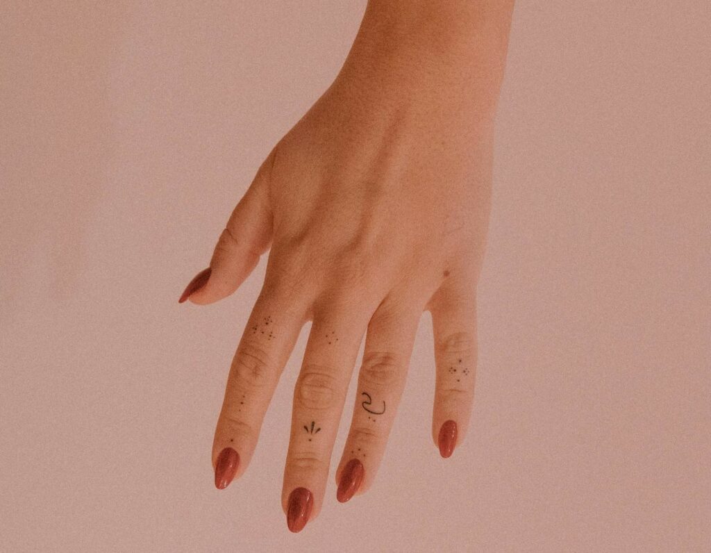classy womens finger tattoo