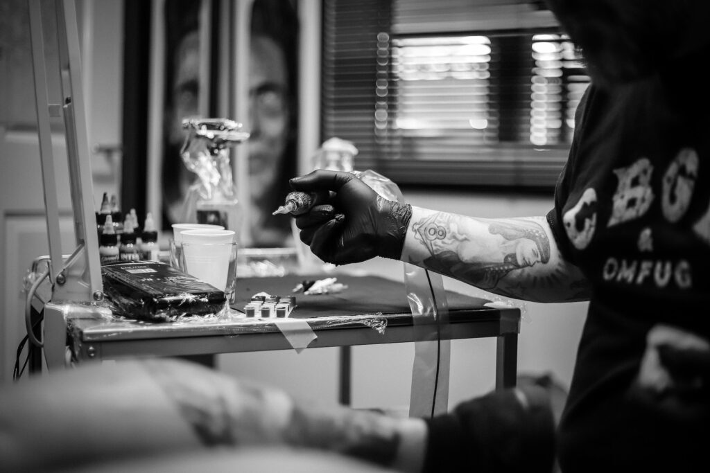 man tattooing
